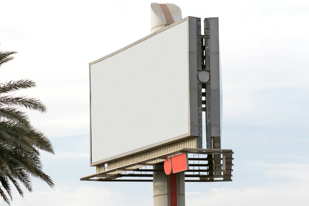 Outdoor billboard on a city street representing traditional advertising